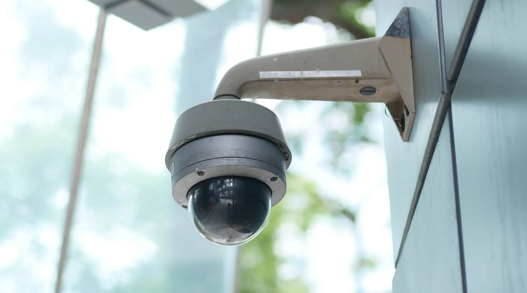 Security camera installed under a building eave