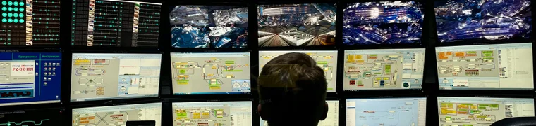 Security monitoring station with a wall of live video surveillance screens